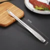 sg-11134201-7rdya-m0xuc2eiq484ff.webp Stainless Steel Barbecue Tongs 28cm | Long Handle Non-Slip Kitchen Tongs for Grilling & Food Handling